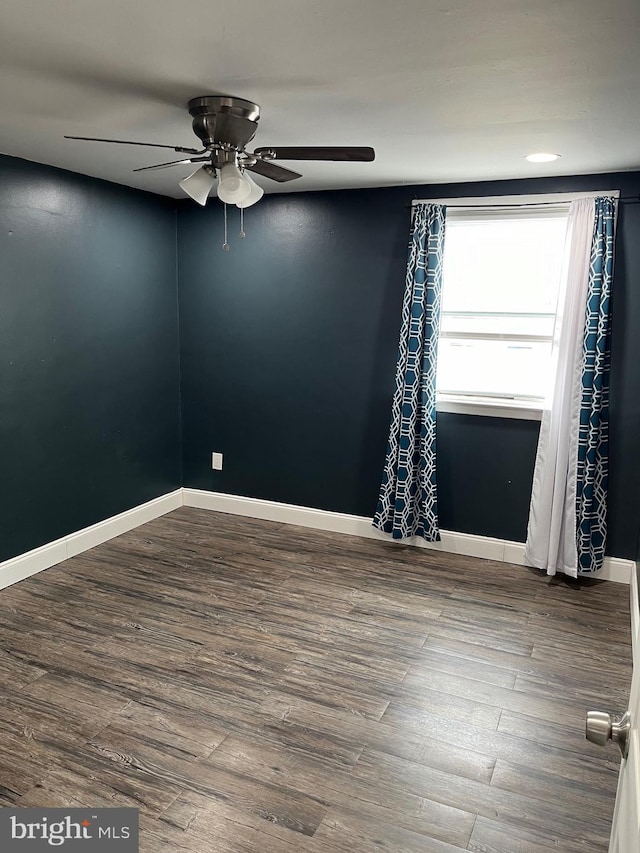 unfurnished room featuring ceiling fan and wood-type flooring