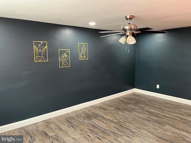 empty room featuring hardwood / wood-style flooring and ceiling fan