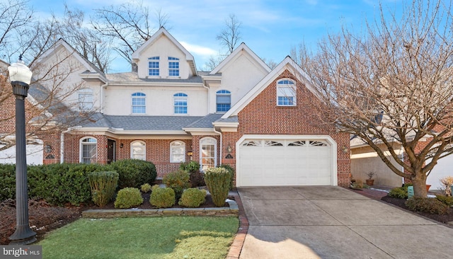 view of front of home featuring a garage and a front yard