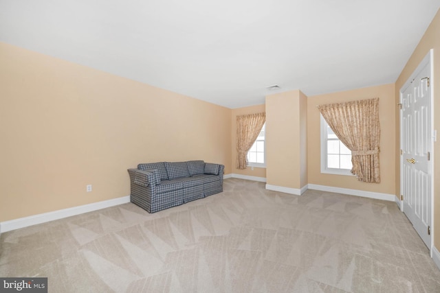 living area with light colored carpet