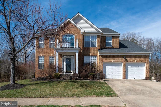 view of front of house featuring brick siding, a front lawn, a garage, a balcony, and driveway