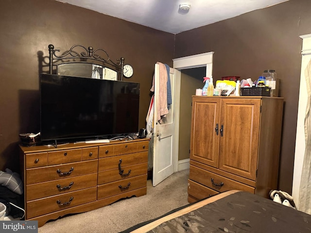 bedroom with light colored carpet