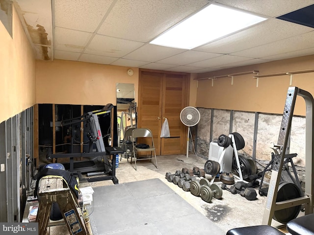 exercise area featuring a paneled ceiling