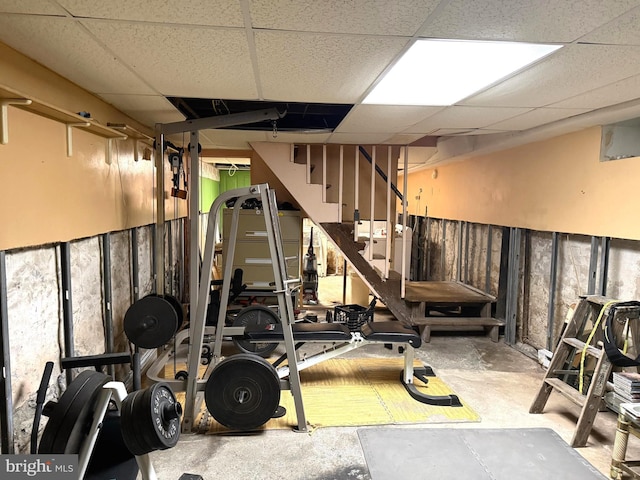 workout area featuring a paneled ceiling