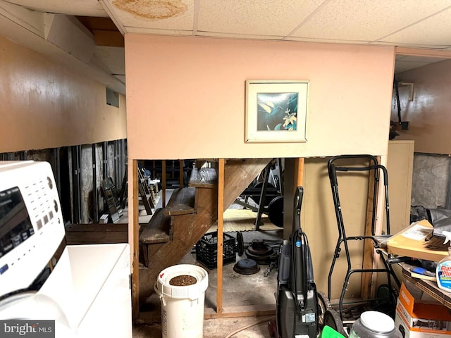 interior space with washer / clothes dryer and a drop ceiling