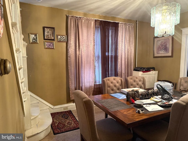 dining space with a notable chandelier