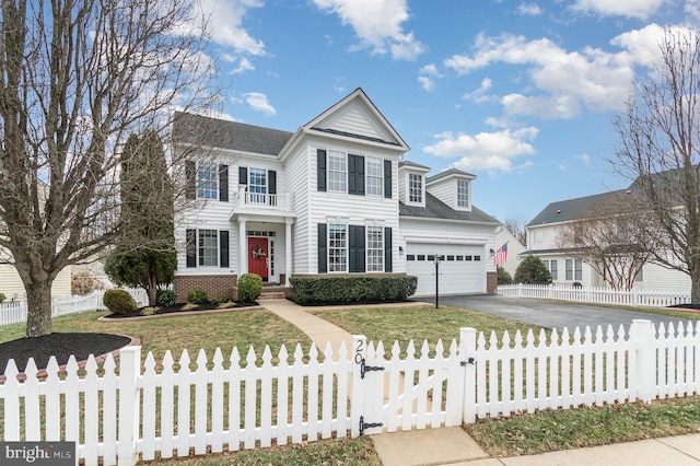 view of front of house with driveway, a garage, brick siding, a fenced front yard, and a front yard