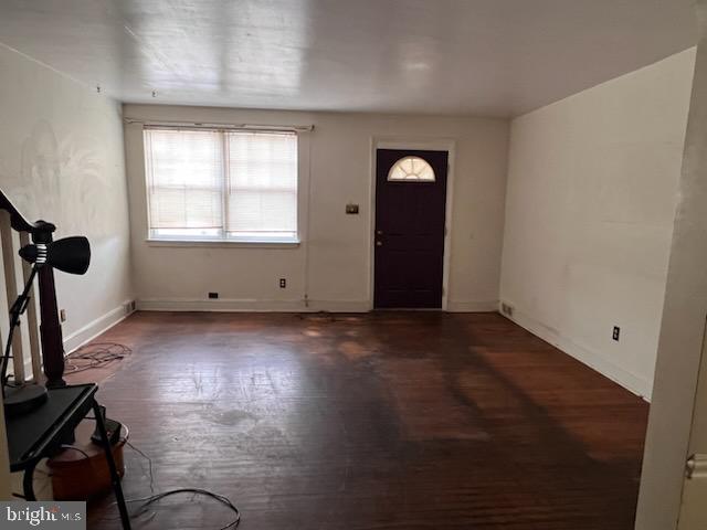 entrance foyer featuring dark hardwood / wood-style floors