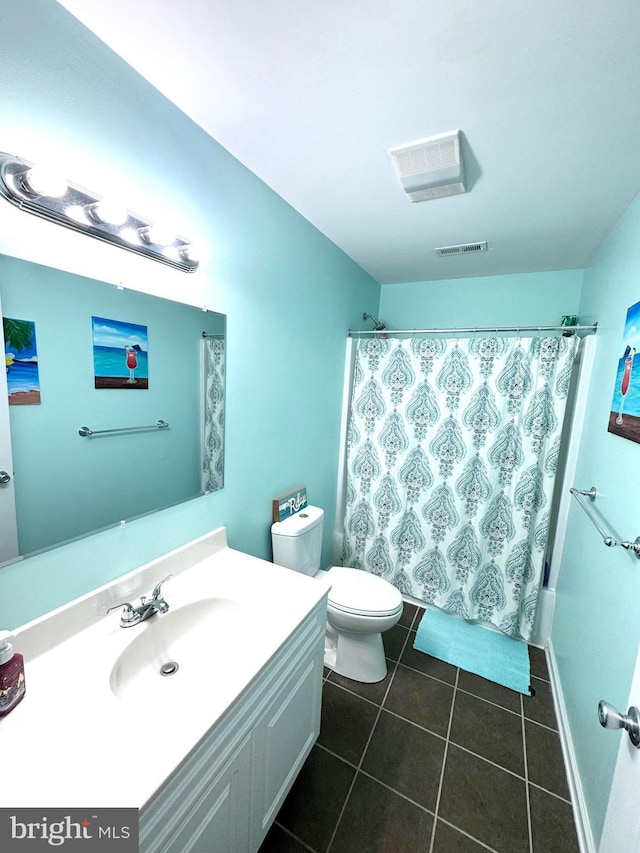 full bathroom featuring vanity, a shower with curtain, visible vents, tile patterned floors, and toilet