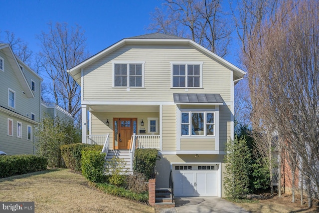 view of front facade featuring concrete driveway, an attached garage, a standing seam roof, a porch, and stucco siding