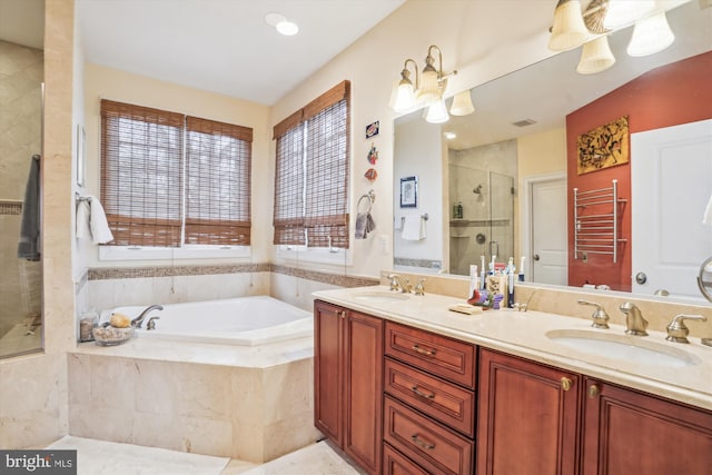 bathroom with a sink, double vanity, a bath, and a shower stall