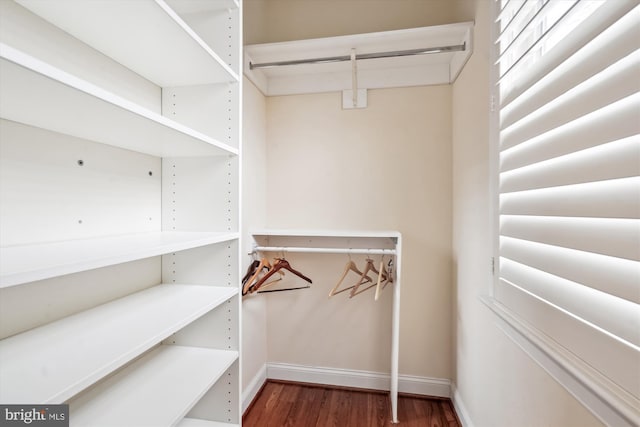 spacious closet with wood finished floors