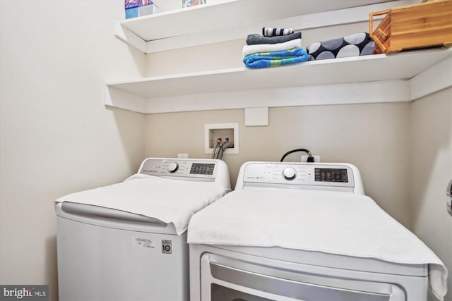 clothes washing area featuring laundry area and independent washer and dryer