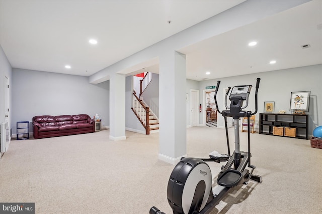 exercise area featuring visible vents, recessed lighting, baseboards, and light carpet