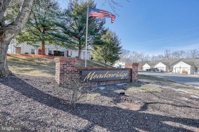 community / neighborhood sign featuring a residential view