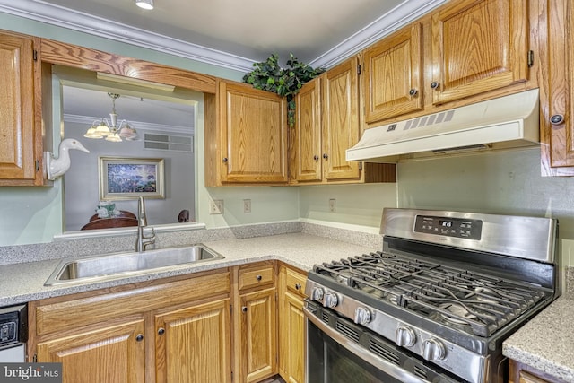 kitchen with under cabinet range hood, a sink, light countertops, ornamental molding, and gas stove