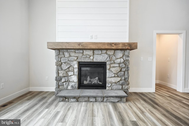 details featuring wood-type flooring and a fireplace