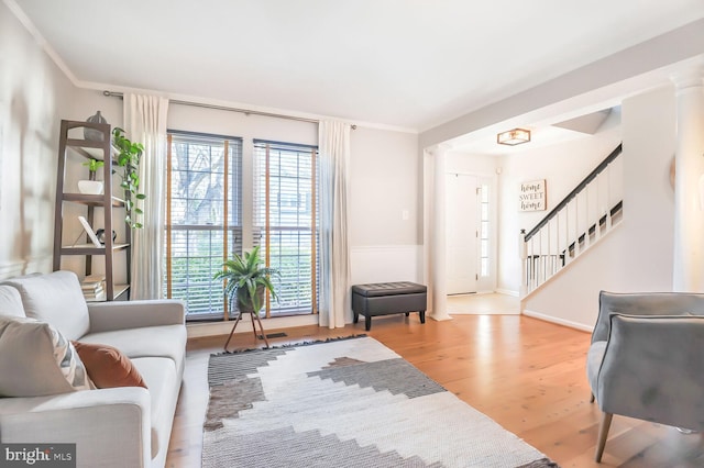 interior space featuring light wood-type flooring and crown molding