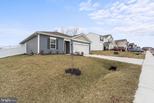 view of front of home with concrete driveway, fence, a garage, a residential view, and a front lawn