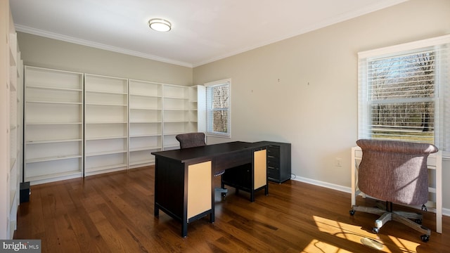 office space with dark wood-style floors, a healthy amount of sunlight, and ornamental molding