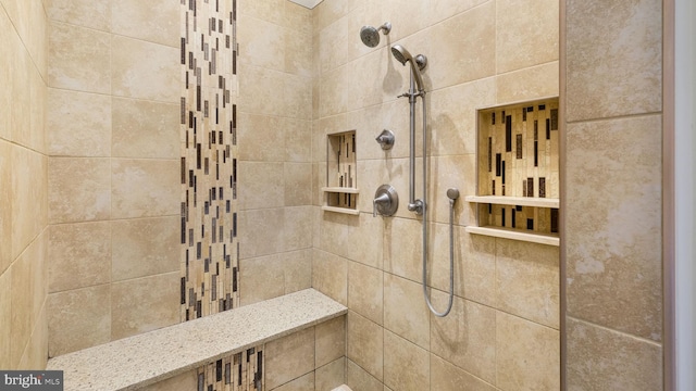 bathroom with a tile shower