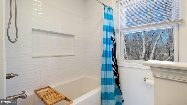 bathroom with shower / bath combination with curtain