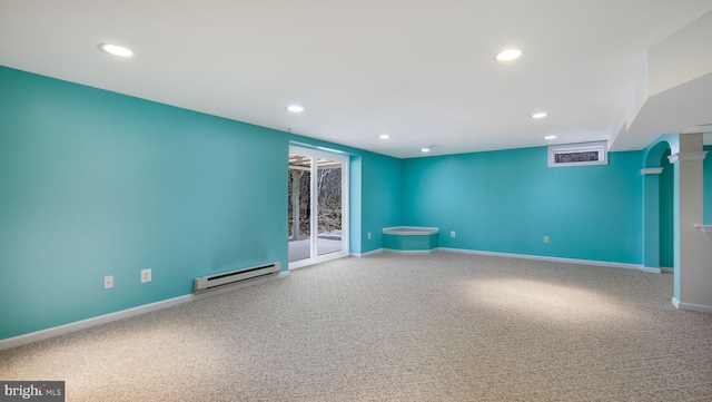 empty room with carpet, recessed lighting, baseboards, and baseboard heating