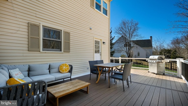 wooden deck with an outdoor living space, outdoor dining area, and a grill