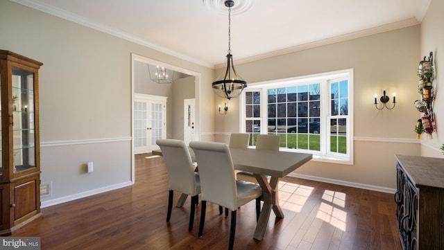 dining space featuring french doors, baseboards, dark wood-style flooring, and crown molding