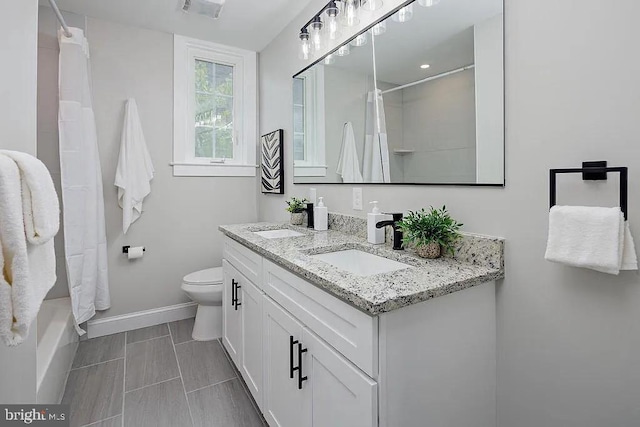 full bathroom with vanity, toilet, and shower / bath combo