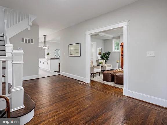 foyer entrance featuring dark hardwood / wood-style floors