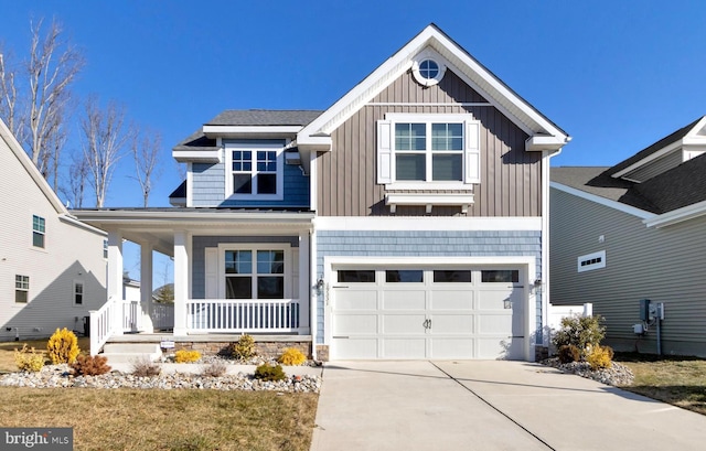 craftsman inspired home featuring board and batten siding, driveway, a garage, and a porch