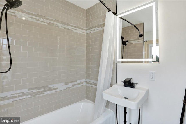 full bathroom with a sink and shower / bath combination with curtain