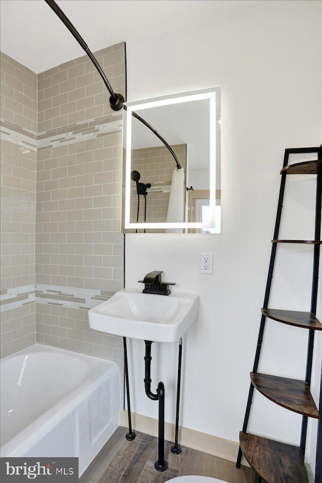 full bathroom with wood finished floors