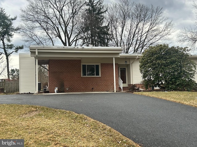 view of front of property with aphalt driveway and brick siding