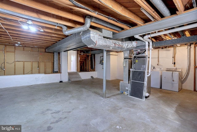 unfinished below grade area featuring washer and clothes dryer