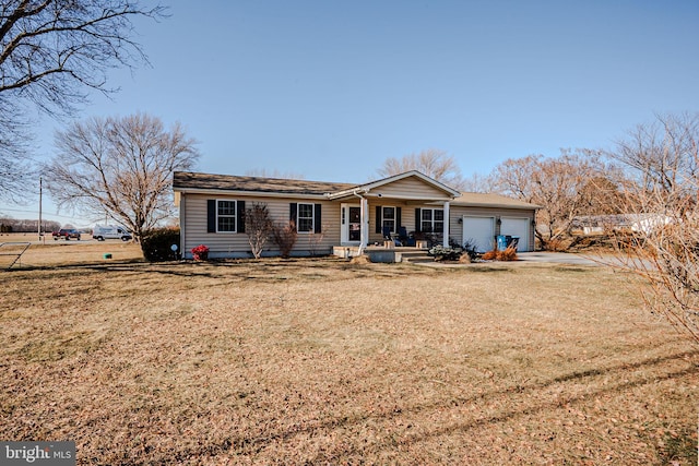 view of front of house featuring a porch, a front yard, and an attached garage