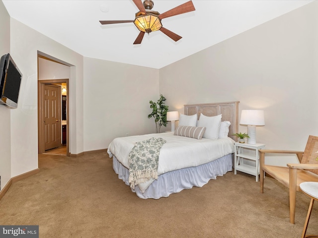 bedroom with baseboards, ceiling fan, lofted ceiling, and light colored carpet