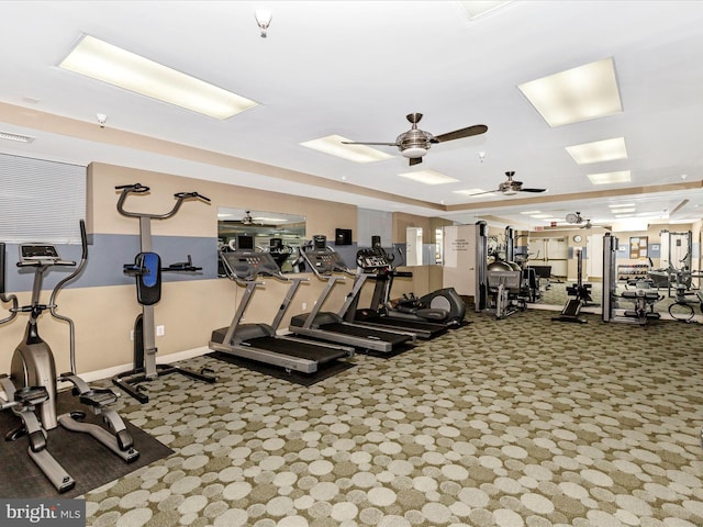 gym with baseboards, carpet, visible vents, and a ceiling fan