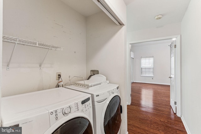 laundry area with dark wood-style flooring, independent washer and dryer, baseboards, and laundry area