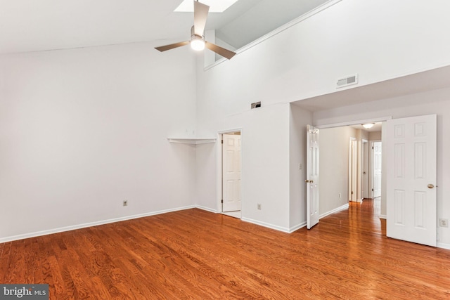 unfurnished bedroom featuring baseboards, visible vents, and wood finished floors