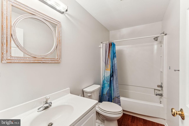 full bathroom with vanity, shower / bathtub combination with curtain, toilet, and wood finished floors