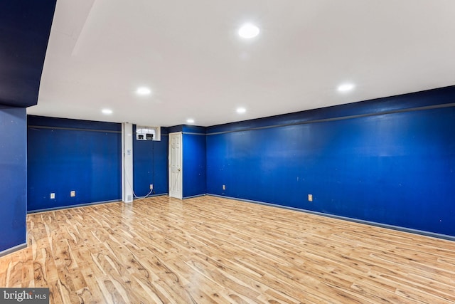 unfurnished room featuring light wood-type flooring, baseboards, and recessed lighting