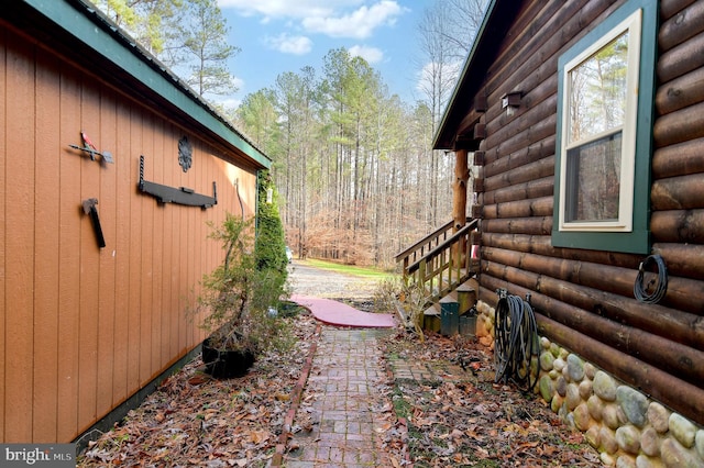 view of side of home featuring a patio area