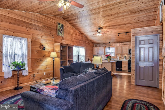 living room with light wood-type flooring, wood walls, and wooden ceiling