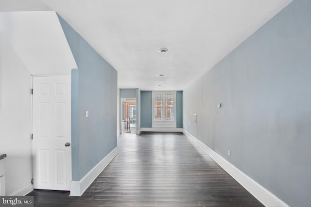 corridor with dark hardwood / wood-style floors