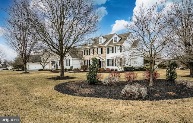 view of front of property featuring a garage and a front yard