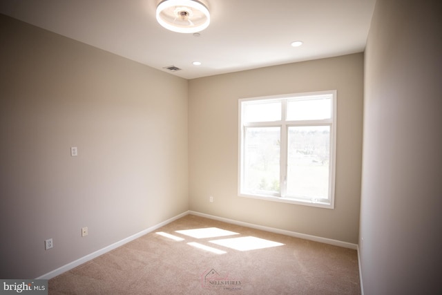 carpeted empty room with recessed lighting, visible vents, baseboards, and plenty of natural light