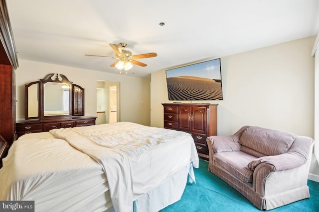 carpeted bedroom with ceiling fan and ensuite bathroom