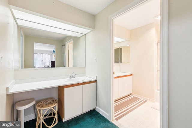 bathroom featuring vanity and baseboards